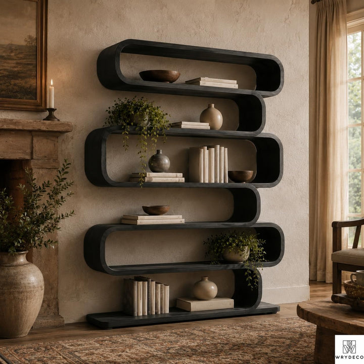 Modern Curved Wood Bookcase for Living Room Display - View 1. Sculptural Curved Storage A statement solid wood bookshelf that combines open storage with a flowing curved silhouette, bringing warmth, artistic character, and practical display space into modern interiors. 01 Sculptural Curved Design The flowing curved silhouette blends functional shelving with an artistic form, creating a modern focal point while providing open display space for books, plants, décor, and everyday objects. 02 Solid Wood Craf...