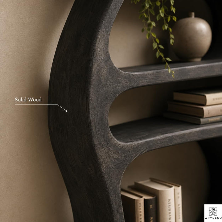 Sculptural Curved Solid Wood Bookshelf for Modern Interiors - View 3. Sculptural Curved Storage A statement solid wood bookshelf that combines open storage with a flowing curved silhouette, bringing warmth, artistic character, and practical display space into modern interiors. 01 Sculptural Curved Design The flowing curved silhouette blends functional shelving with an artistic form, creating a modern focal point while providing open display space for books, plants, décor, and everyday objects. 02 Solid W...
