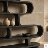Curved Wood Display Bookcase with Modern Storage Design - View 3. Sculptural Curved Storage A statement solid wood bookshelf that combines open storage with a flowing curved silhouette, bringing warmth, artistic character, and practical display space into modern interiors. 01 Sculptural Curved Design The flowing curved silhouette blends functional shelving with an artistic form, creating a modern focal point while providing open display space for books, plants, décor, and everyday objects. 02 Solid Wood ...
