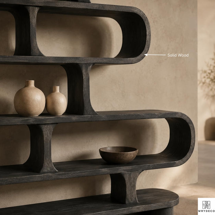 Curved Wood Display Bookcase with Modern Storage Design - View 3. Sculptural Curved Storage A statement solid wood bookshelf that combines open storage with a flowing curved silhouette, bringing warmth, artistic character, and practical display space into modern interiors. 01 Sculptural Curved Design The flowing curved silhouette blends functional shelving with an artistic form, creating a modern focal point while providing open display space for books, plants, décor, and everyday objects. 02 Solid Wood ...